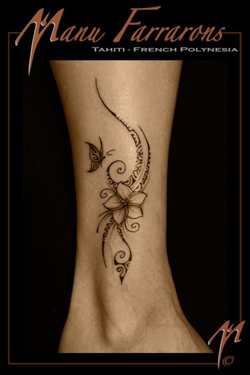 a woman's foot with a butterfly tattoo on the side of her leg and an inscription