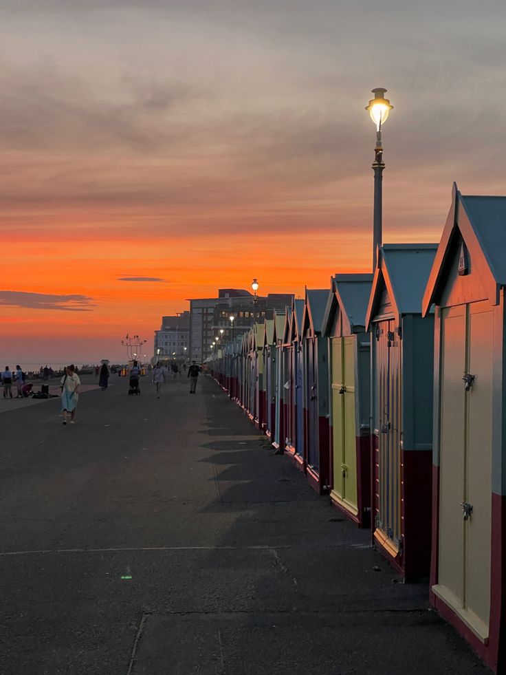 a row of beach huts sitting next to each other