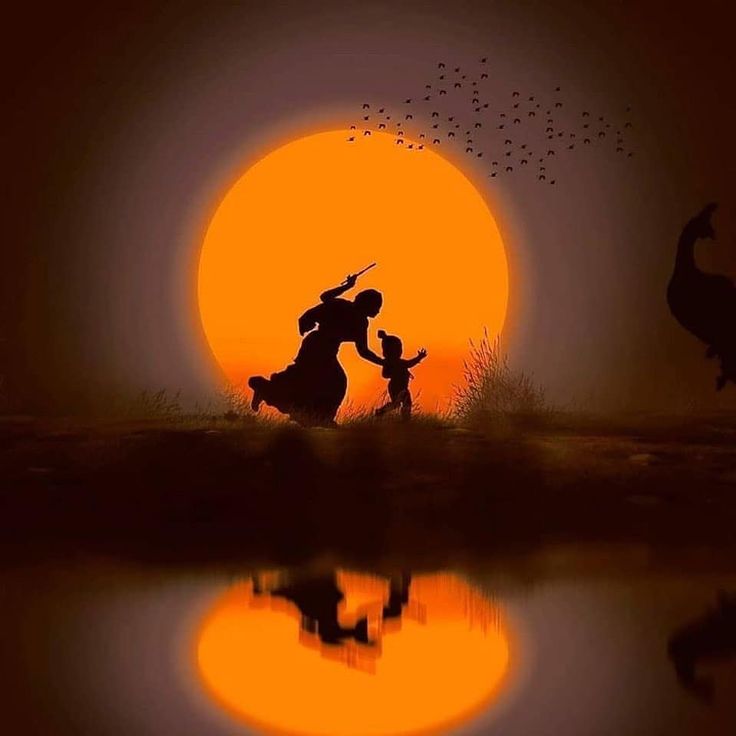 the silhouettes of two people and an animal in front of a sunset