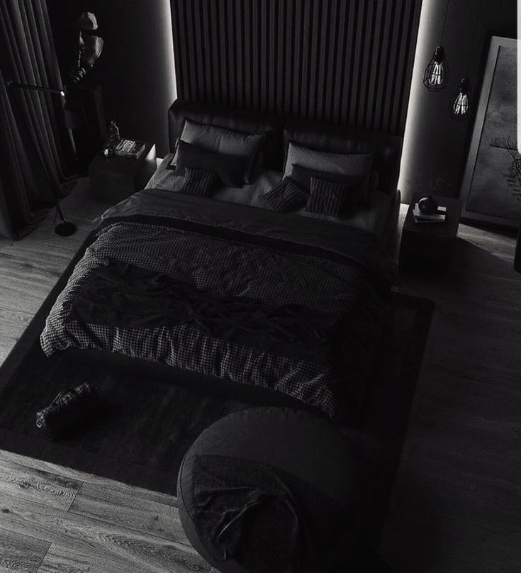 a black and white photo of a bed in a bedroom