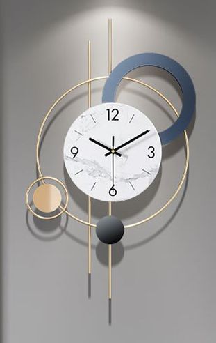 a clock that is on the side of a wall with circles and balls around it