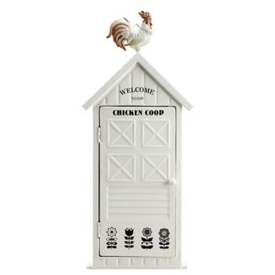 a chicken is perched on top of a small white house with the words chicken coop painted on it