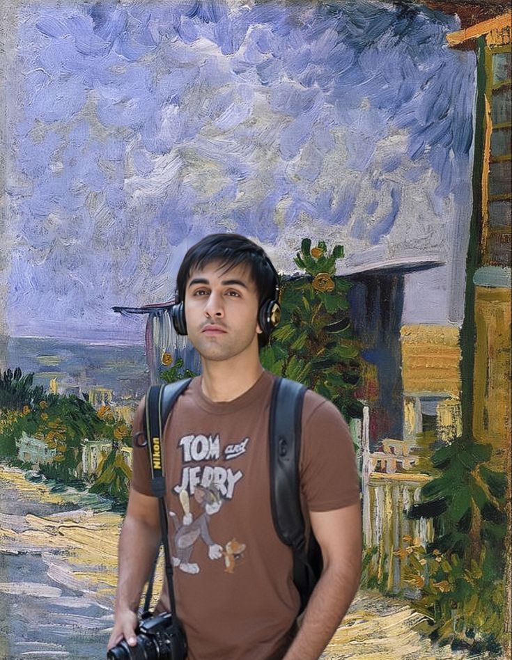 a man standing in front of a painting with headphones on and holding a camera