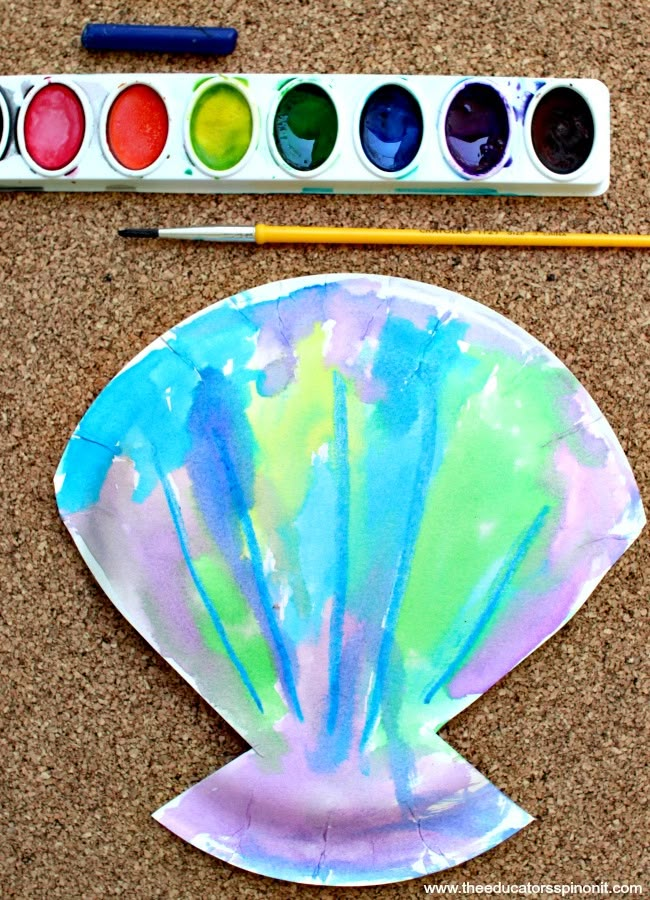 an art project with watercolors and paper plates