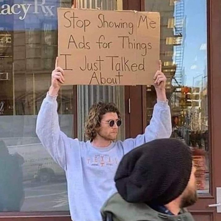 a man holding up a sign that says stop showing me acts for things i just talked about