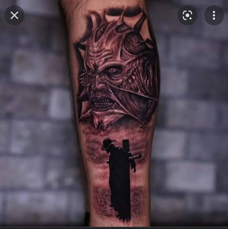 a man with a tattoo on his arm holding a knife in front of a demon