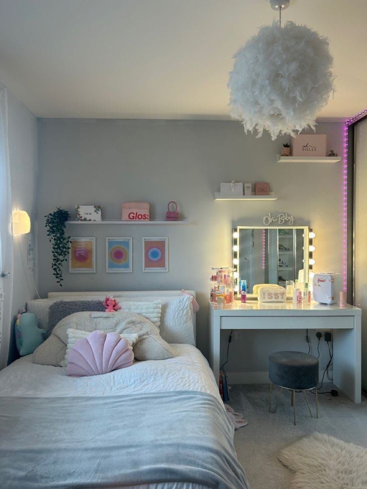 a bedroom with a bed, desk and mirror