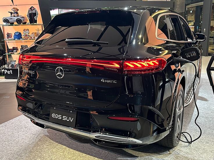 an electric vehicle is on display in a showroom