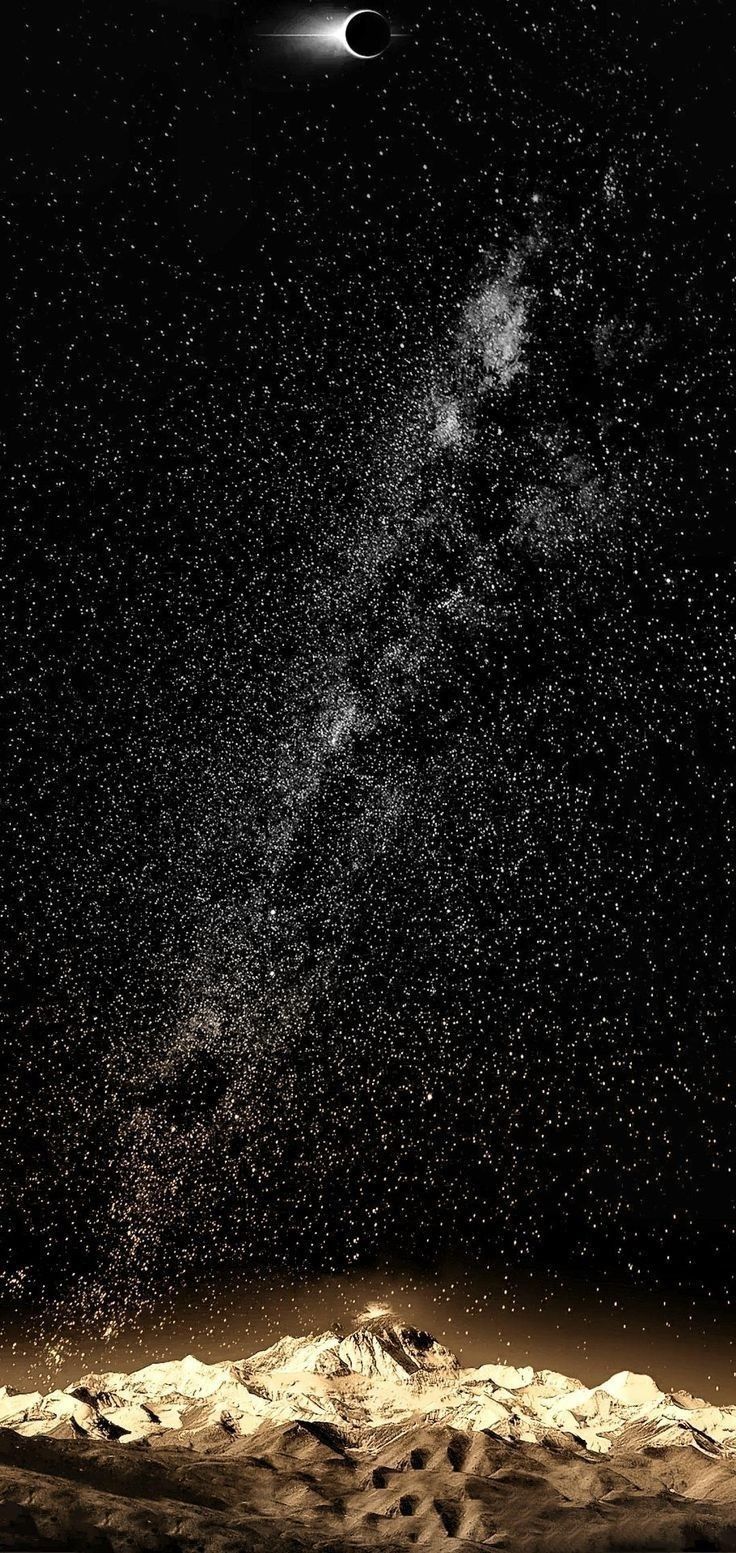 an image of the stars and planets in the night sky over mountains with snow on them