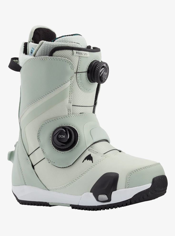 the snowboard boots are white and have black buttons on each side of the boot