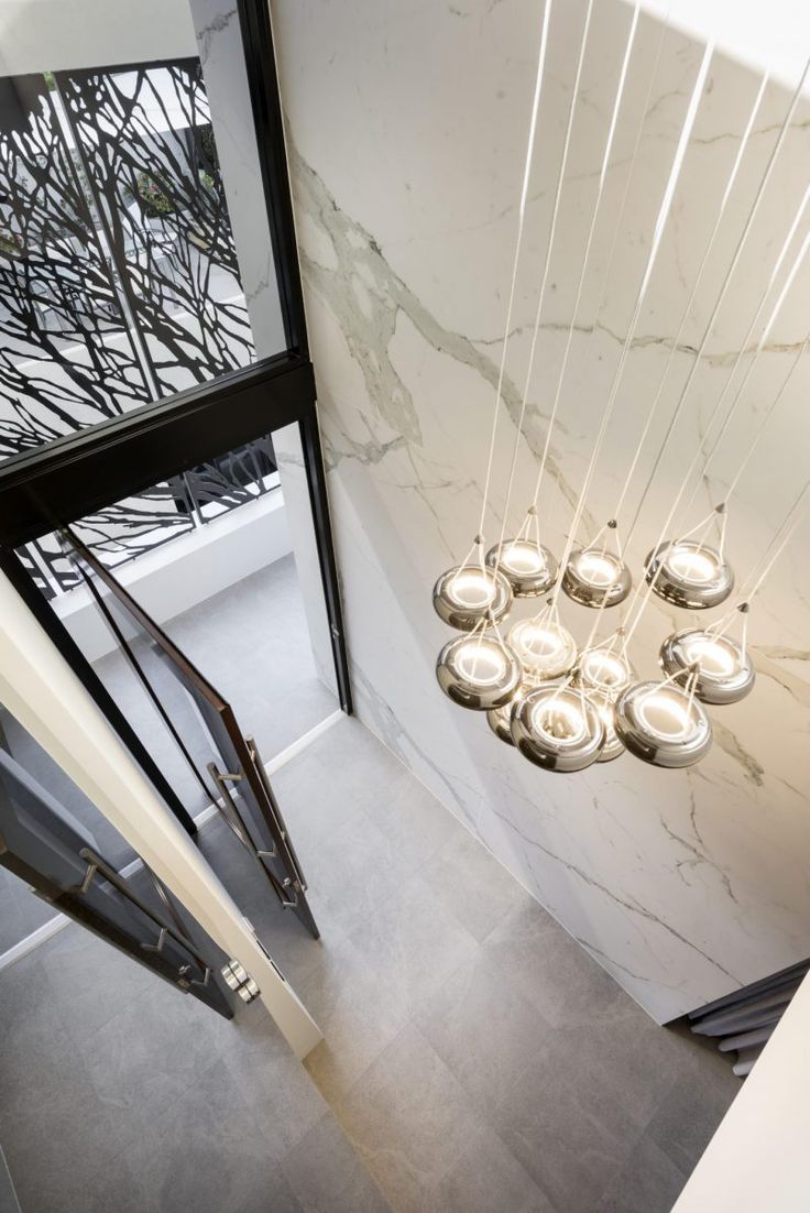 an overhead view of a stairwell with hanging lights