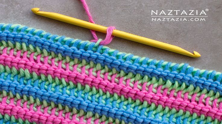 the crochet stitch is next to a knitting needle