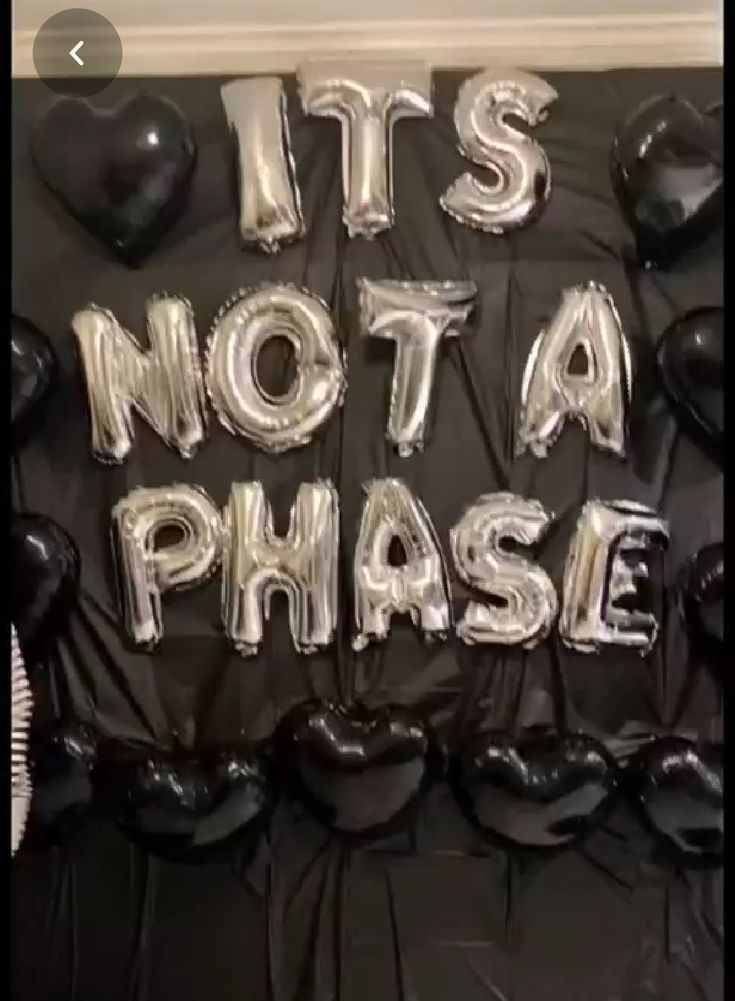 balloons that say it's not a phase and are black with white letters on them