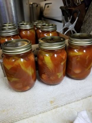 several jars filled with food sitting on top of a counter