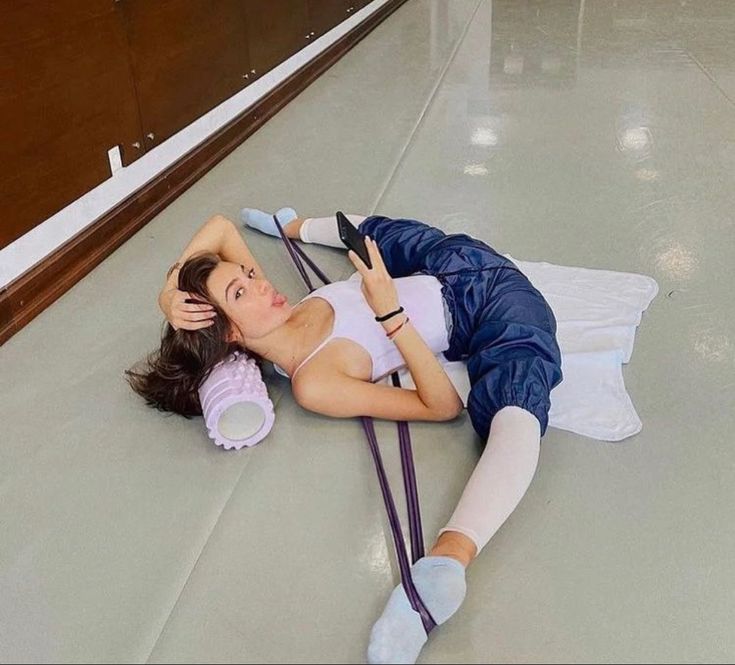 a woman laying on the floor with a stethoscope