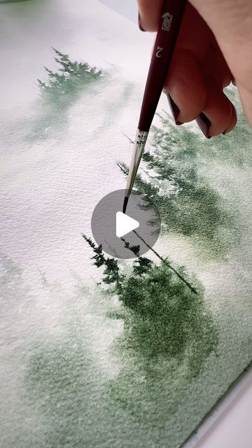 someone is using a paintbrush to draw trees