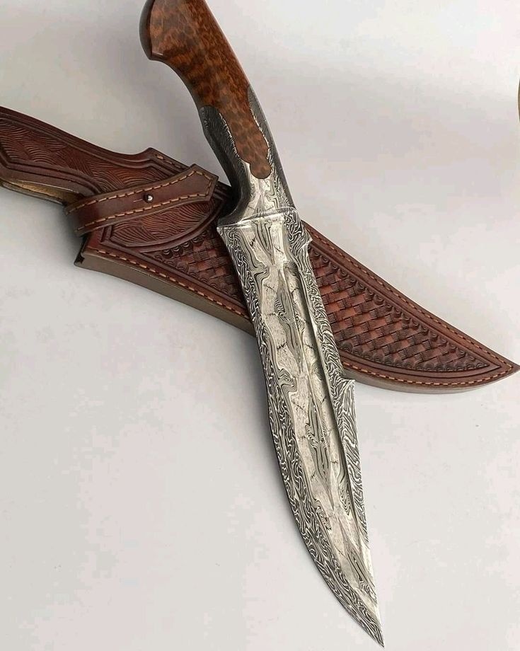 an intricately designed knife is mounted on the wall