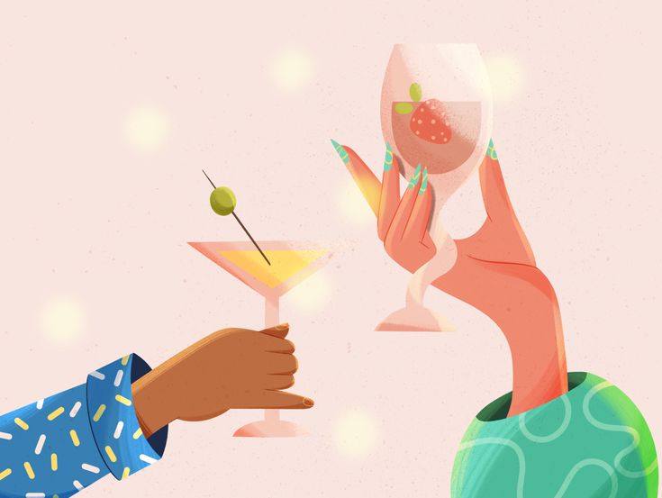 two people are toasting with cocktails in their hands, one is holding an olive