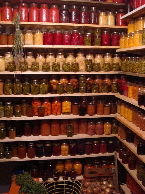 the shelves are filled with many different kinds of jars