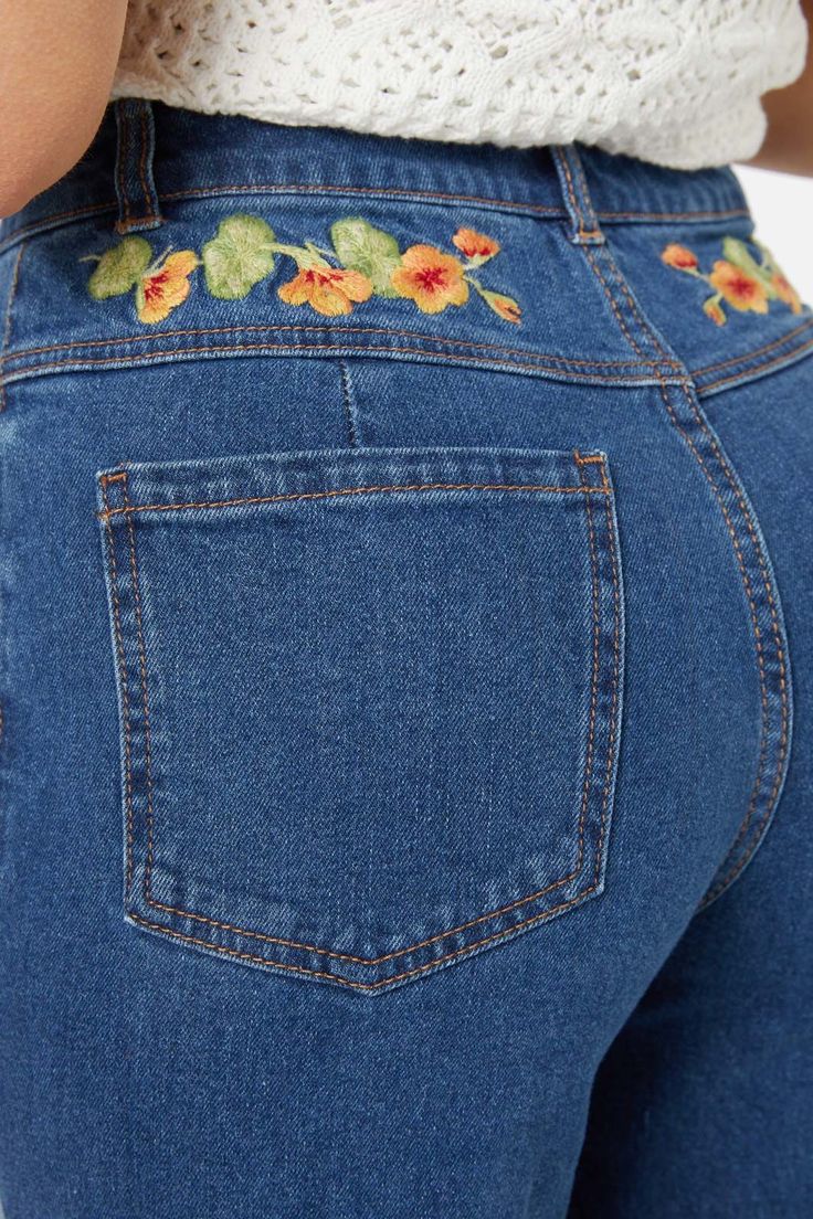 Floral embroidered straight leg jean, featuring gorgeous hand painted nasturtium flowers - Nasturtim mbroidery along front pockets and back yoke- high waisted style- relaxed fit through the leg- front fly with button closure- curved front pockets- patch pockets on back - comfortable cotton elastane denim- available in mid denim Product Code: PGFY272 Hand Embroidered Clothes, Denim Painting, Jean Patches, Nasturtium Flowers, Painting Jeans, Patch Jeans, Denim Embroidery, Jeans Embroidered, Sewing Clothing