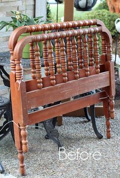 an old wooden bench sitting in front of a brick building