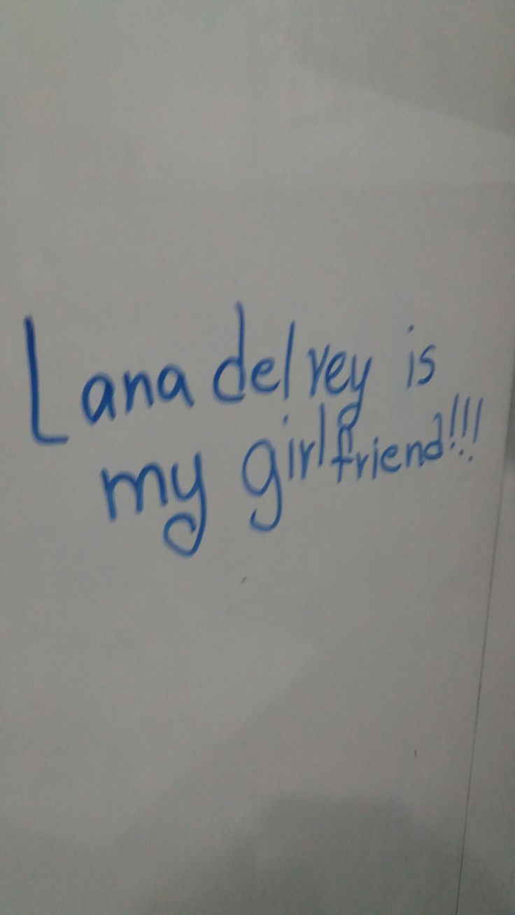 a white sign with blue writing on it that says lana deley is my girlfriend