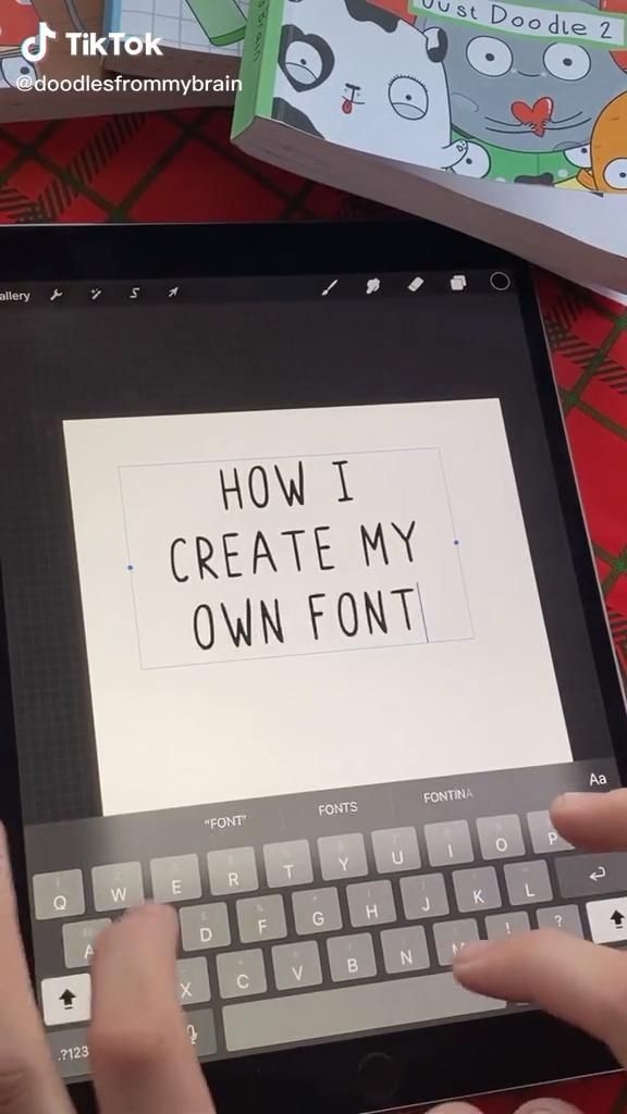 someone is typing on an ipad keyboard with the words how i create my own font