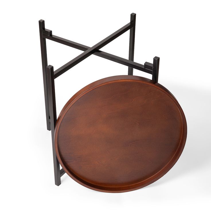 a round wooden table with black metal frame around the top and bottom, on a white background