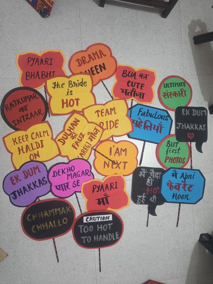 a bunch of colorful speech bubbles with words written in different languages on them sitting on the floor