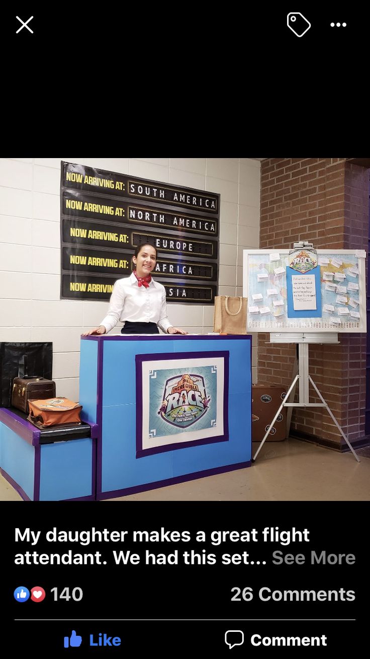 a man standing behind a blue counter in a room