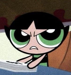 the powerpuff character is sitting in bed with her head on top of a pillow