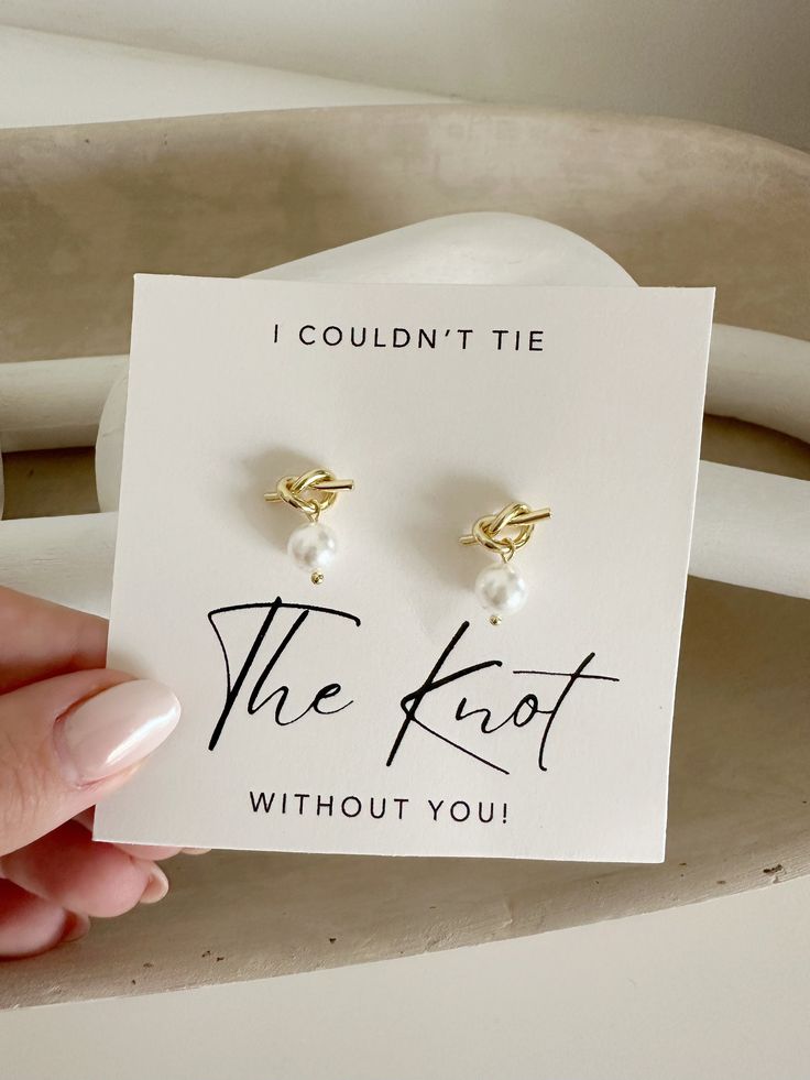 a pair of earrings that say i couldn't tie the knot without you