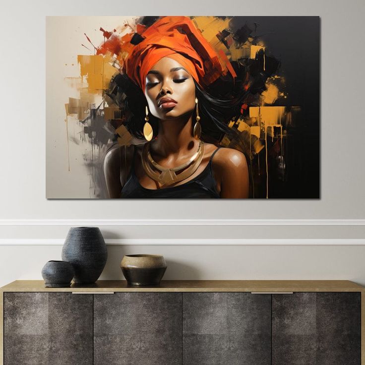 a woman with an orange turban on her head standing in front of a painting