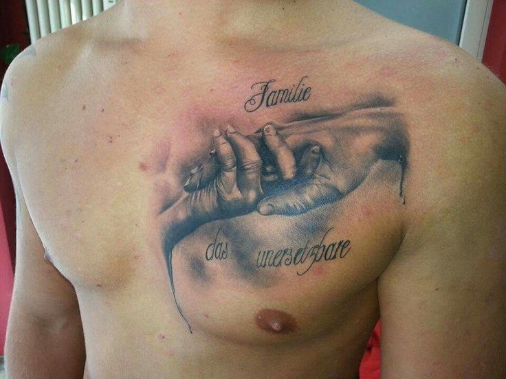 a man with a tattoo on his chest that says, family is the only hope