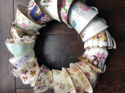 a wreath made out of old china cups