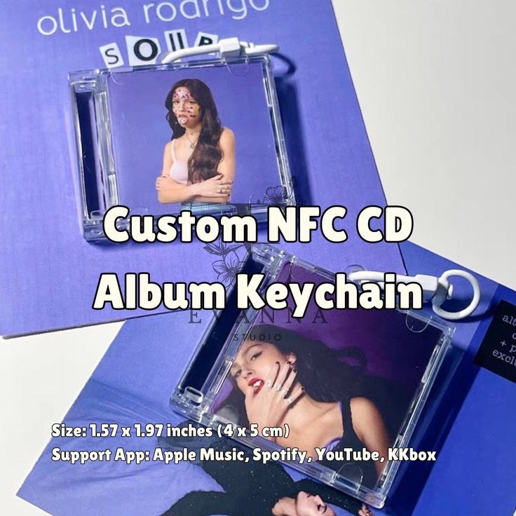 two cd's sitting on top of each other with the words custom nc cd album keychain