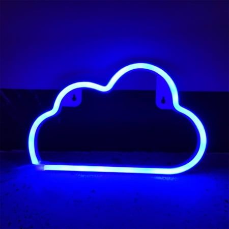 a neon blue cloud shaped object sitting on top of a floor next to a wall