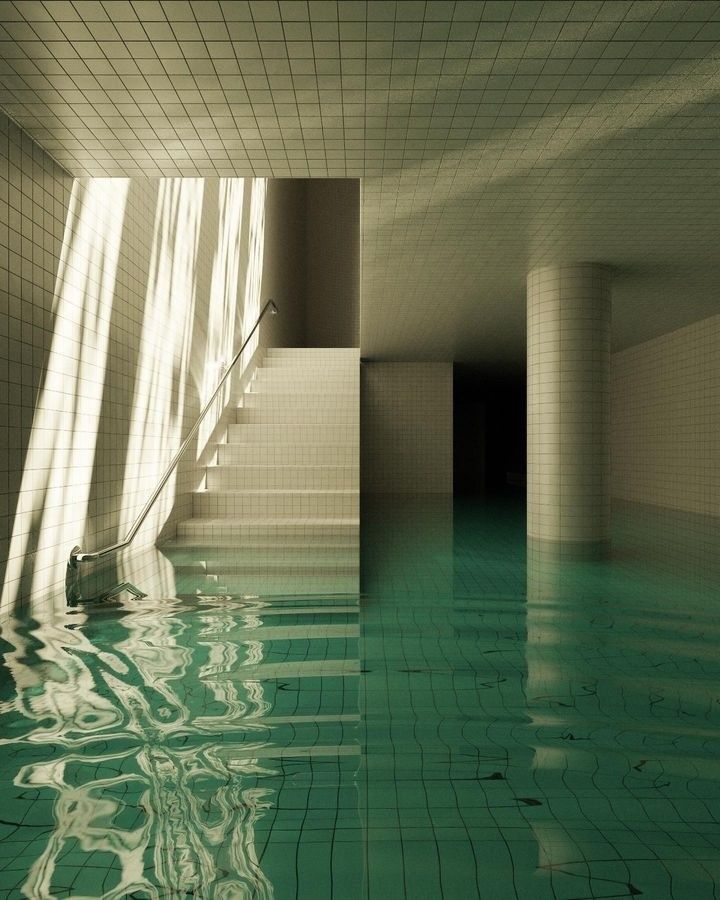 an empty swimming pool with stairs leading up to the water's edge and tiled walls