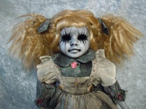 a creepy doll with blonde hair and makeup