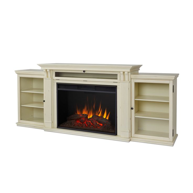 an entertainment center with a fire place and bookcases on either side, in white