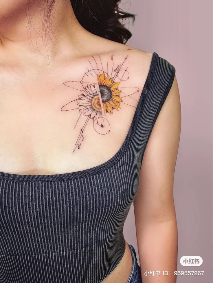 a woman's chest with a sunflower tattoo on her left shoulder and an arrow in the middle