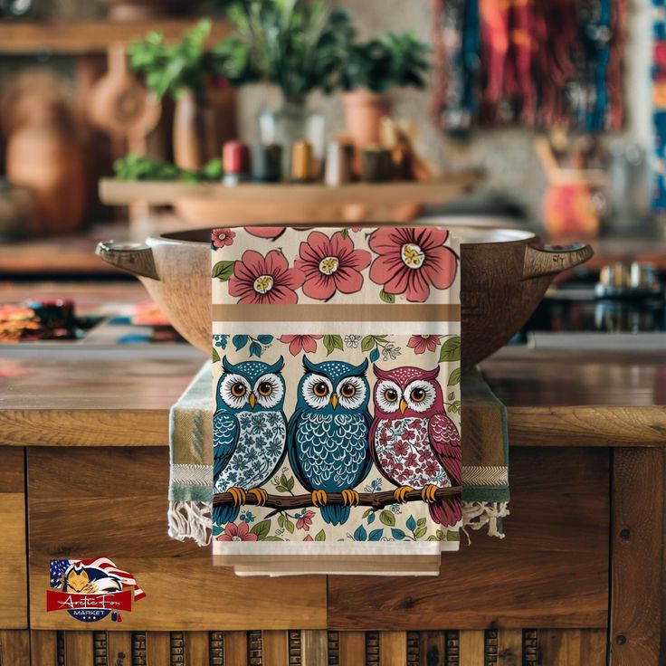 two owls are sitting on the kitchen counter