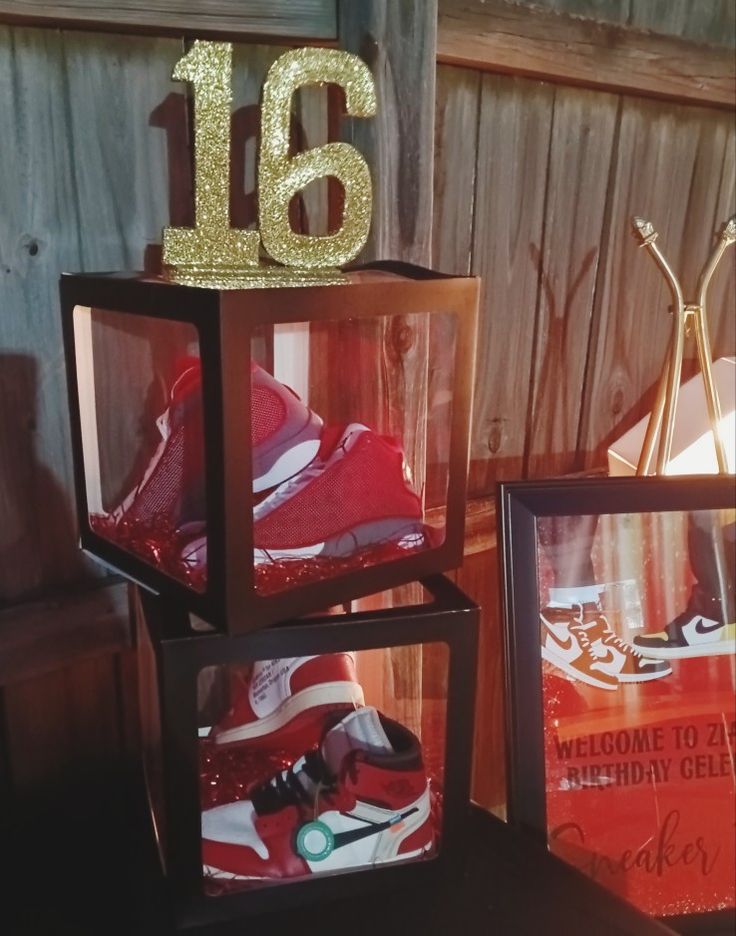 there are three boxes that have some shoes in them and the number 16 is on top