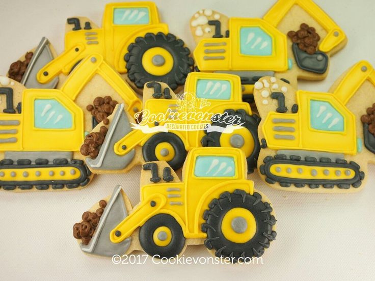 decorated cookies in the shape of construction vehicles