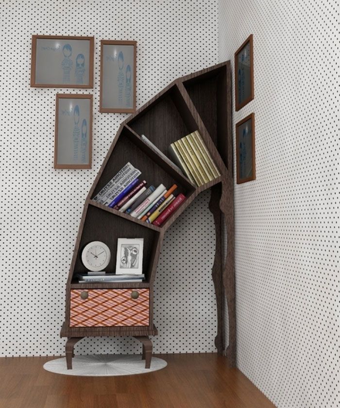 a bookshelf in the corner of a room with pictures on the wall behind it