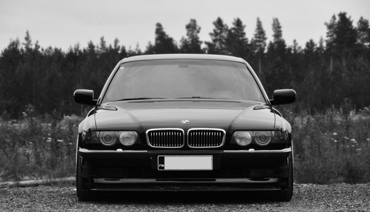 a black and white photo of a bmw