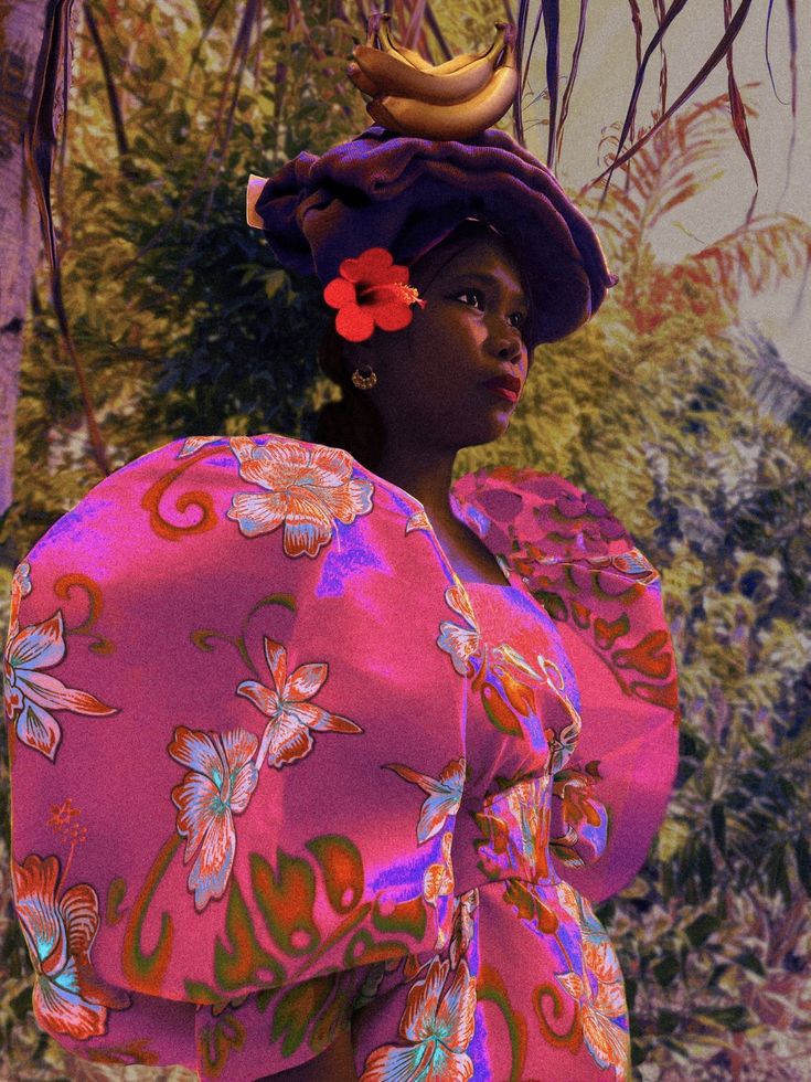 a woman in a pink dress and hat with bananas on her head