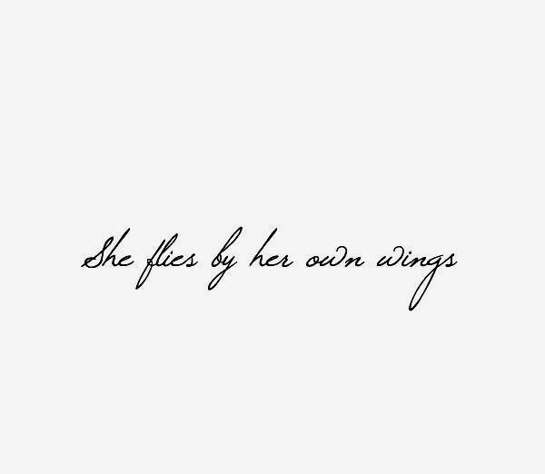 the words she flies by her own wings are written in cursive handwriting on a white background