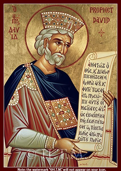 an icon of the person holding a large paper in his hand and wearing a crown