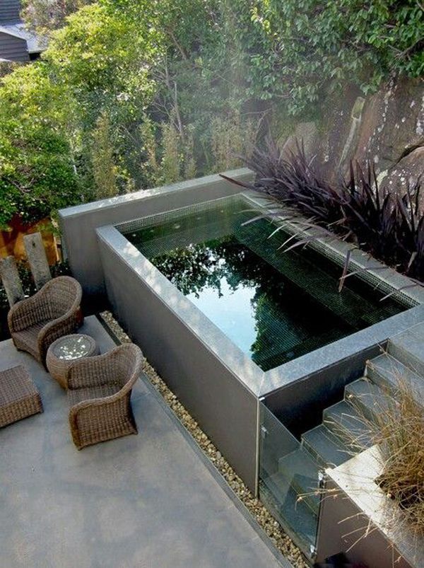 an outdoor pond surrounded by wicker chairs